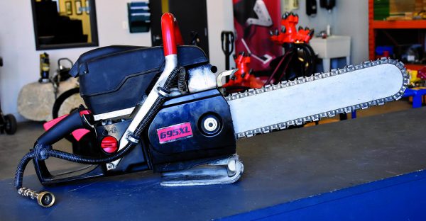 gas powered chain saw on counter ready to rent